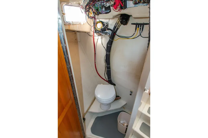 Slide: The Image of 2002 Donelle Express Down East Lobster Boat interior with toilet and wiring. - 9