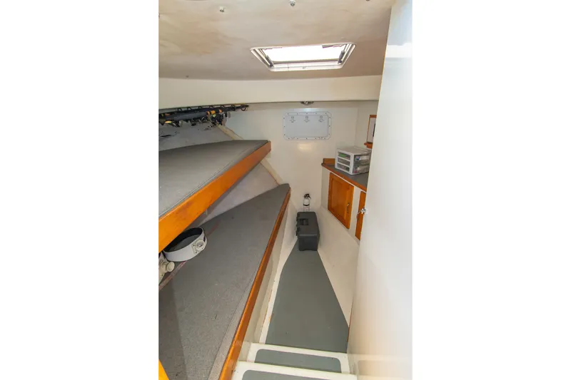 Slide: The Image of Interior cabin of 2002 Donelle Express Down East Lobster Boat with bunks and storage. - 8