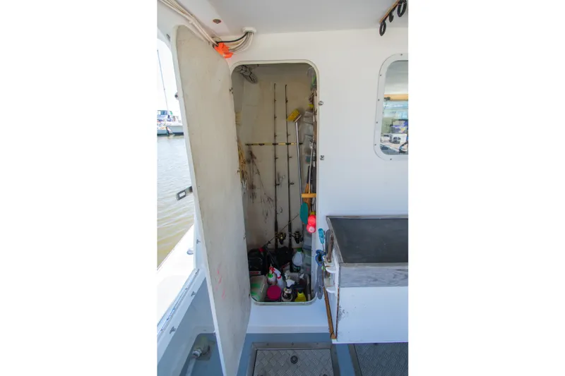 Slide: The Image of Interior of a 2002 Donelle Express Down East Lobster Boat with fishing gear storage. - 27
