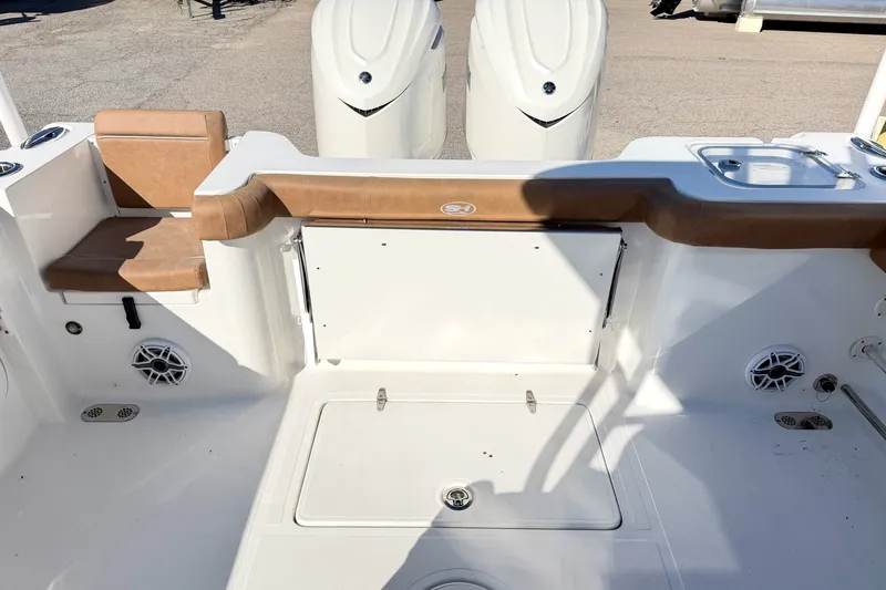 Slide: The Image of 2025 Sea Hunt Gamefish 30FS boat interior with seating and storage compartments. - 6