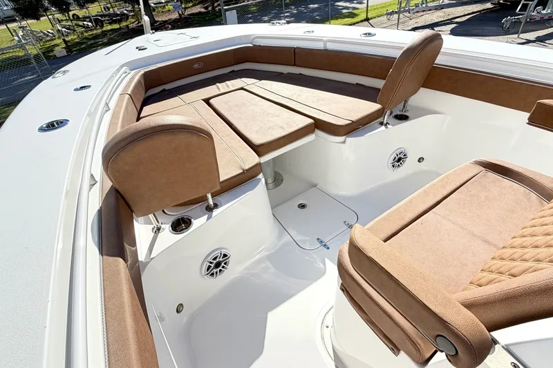 Slide: The Image of 2025 Sea Hunt Gamefish 30FS boat interior with tan seating and modern design. - 25