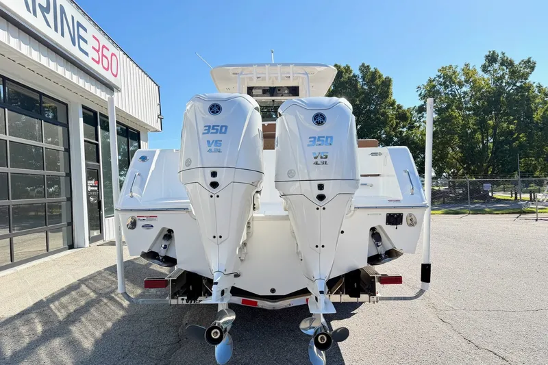 Slide: The Image of 2025 Sea Hunt Gamefish 30FS with twin Yamaha 350 V6 engines at Marine 360 dealership. - 1