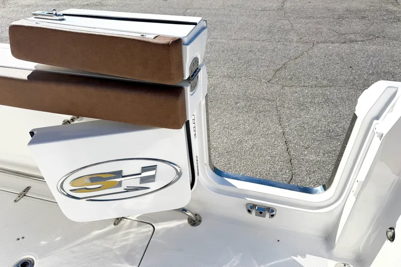 Slide: The Image of 2025 Sea Hunt Gamefish 30FS boat interior with cushioned seating and logo detail. - 3