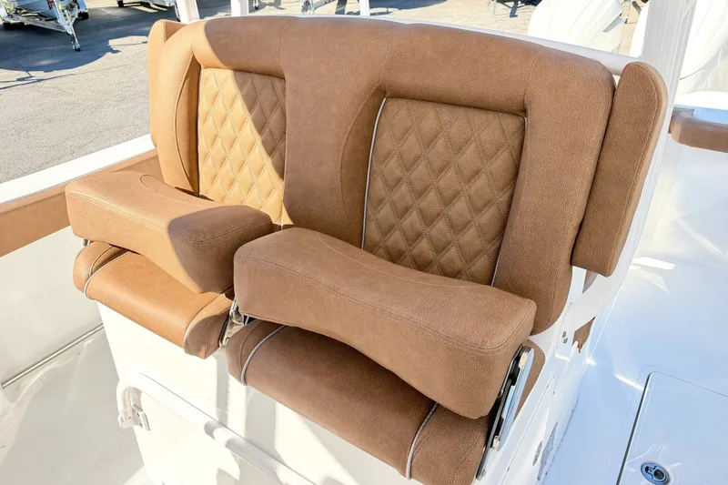 Slide: The Image of Luxurious brown seating on 2025 Sea Hunt Gamefish 30FS boat, featuring diamond-pattern upholstery. - 14
