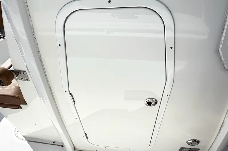 Slide: The Image of White hatch door on 2025 Sea Hunt Gamefish 30FS boat. - 30