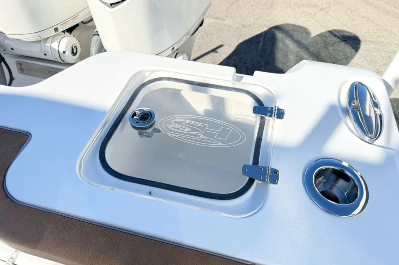 Slide: The Image of 2025 Sea Hunt Gamefish 30FS boat detail with hatch and cup holder. - 7