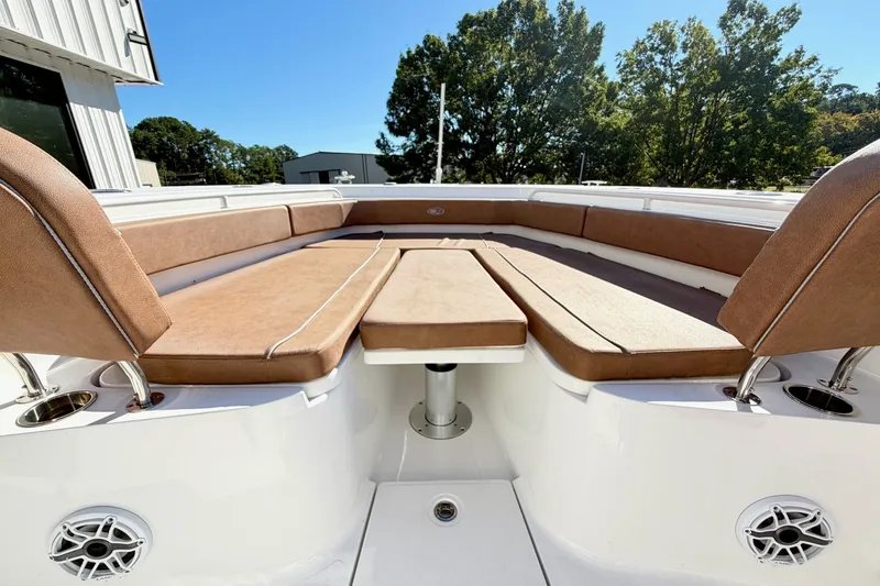Slide: The Image of 2025 Sea Hunt Gamefish 30FS boat interior with tan seating and modern design. - 27