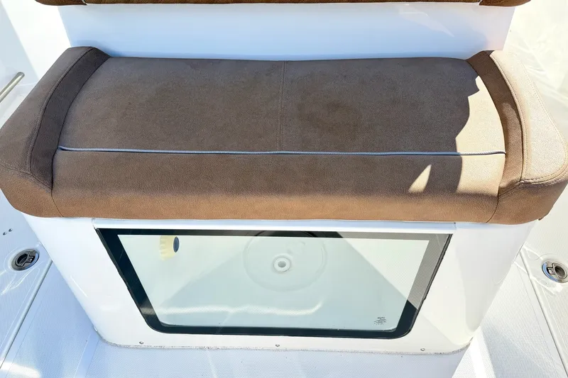 Slide: The Image of Brown cushioned seat on 2025 Sea Hunt Gamefish 30FS boat, featuring a transparent compartment. - 12