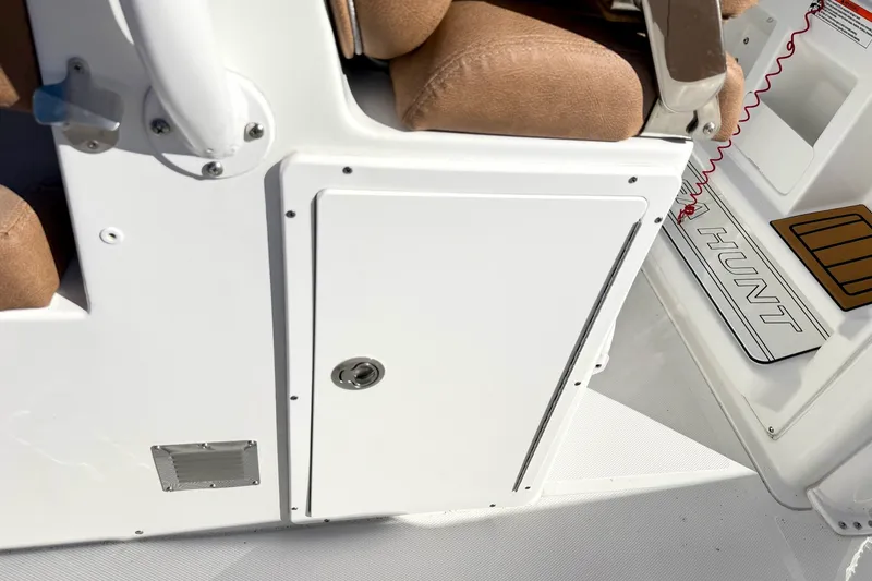 Slide: The Image of 2025 Sea Hunt Gamefish 30FS boat interior with storage compartment and seating. - 17
