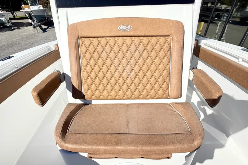 Slide: The Image of 2025 Sea Hunt Gamefish 30FS boat seat with diamond-stitched upholstery and armrests. - 26