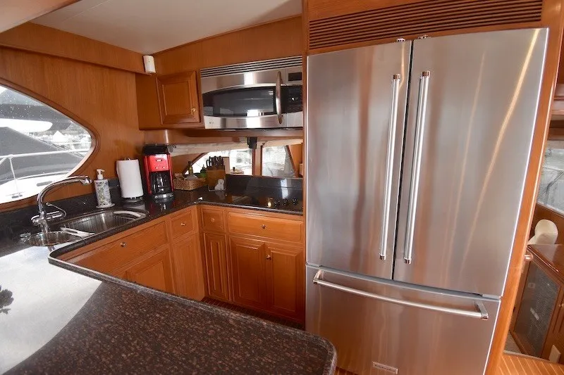 Slide: The Image of Luxurious kitchen in 2004 Ocean Alexander 58 Pilothouse yacht with stainless steel appliances. - 15