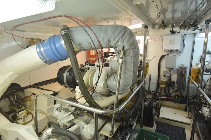 Slide: The Image of Engine room of 2004 Ocean Alexander 58 Pilothouse yacht, showcasing mechanical components and systems. - 40