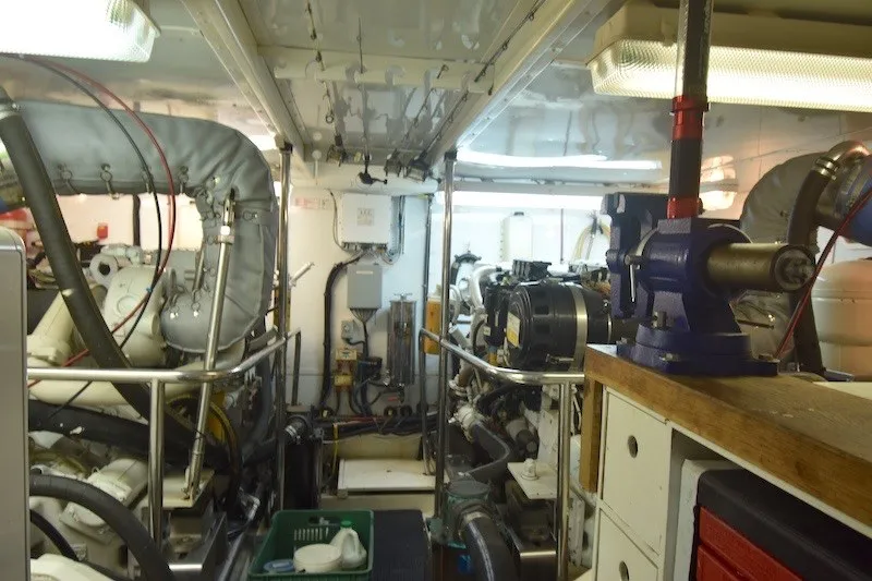 Slide: The Image of Engine room of a 2004 Ocean Alexander 58 Pilothouse yacht, showcasing machinery and equipment. - 39