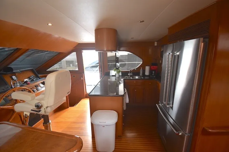 Slide: The Image of Luxurious interior of 2004 Ocean Alexander 58 Pilothouse yacht with modern kitchen amenities. - 13