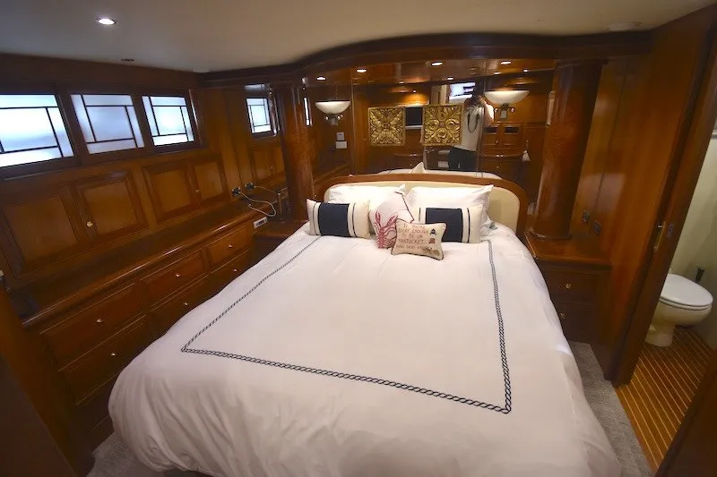 Slide: The Image of Luxurious bedroom interior of 2004 Ocean Alexander 58 Pilothouse yacht with elegant wood finishes. - 22
