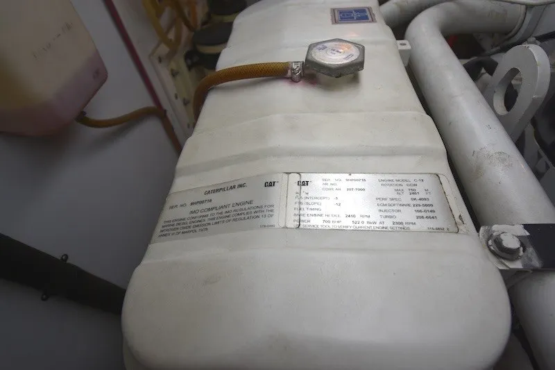 Slide: The Image of Engine compartment of a 2004 Ocean Alexander 58 Pilothouse, featuring a Caterpillar engine. - 43
