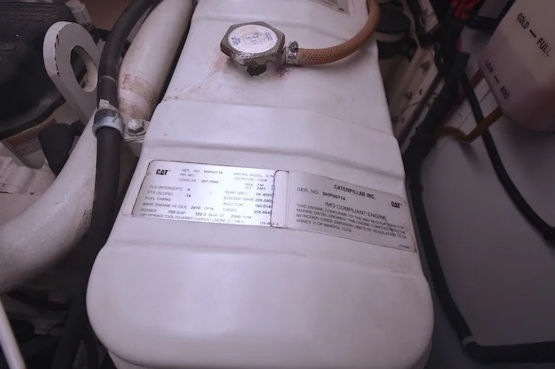 Slide: The Image of Engine compartment of 2004 Ocean Alexander 58 Pilothouse with Caterpillar components. - 44