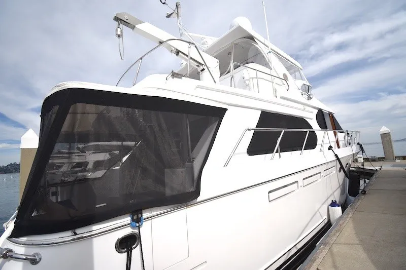 Slide: The Image of 2004 Ocean Alexander 58 Pilothouse yacht docked at marina under clear sky. - 4