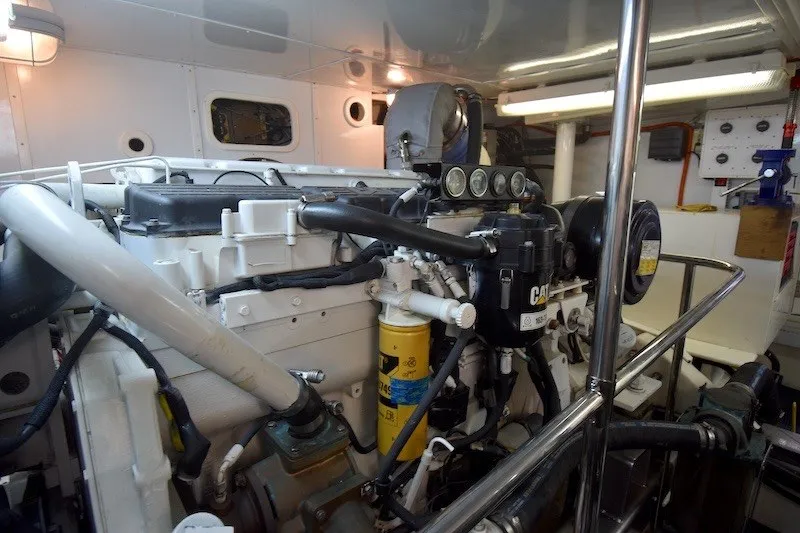 Slide: The Image of Engine room of 2004 Ocean Alexander 58 Pilothouse yacht, showcasing detailed machinery. - 46