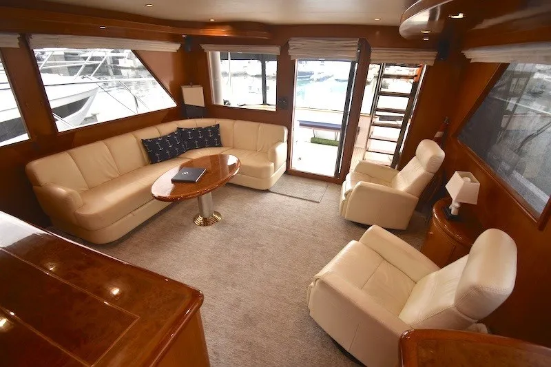 Slide: The Image of Luxurious interior of 2004 Ocean Alexander 58 Pilothouse yacht with plush seating and elegant decor. - 9