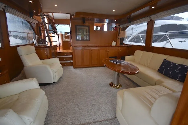 Slide: The Image of Luxurious interior of 2004 Ocean Alexander 58 Pilothouse yacht with elegant seating and wood finishes. - 10