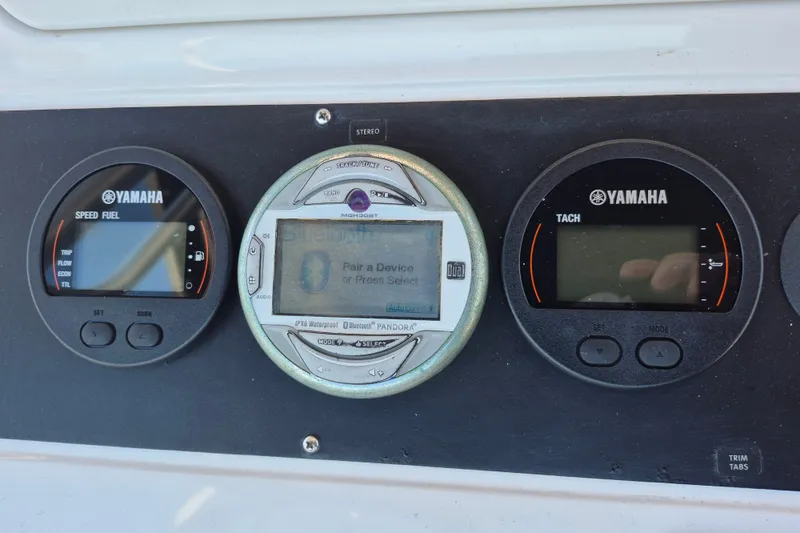 Slide: The Image of Dashboard of a 2000 Pro-Line 24 Sport boat with Yamaha gauges and stereo system. - 41