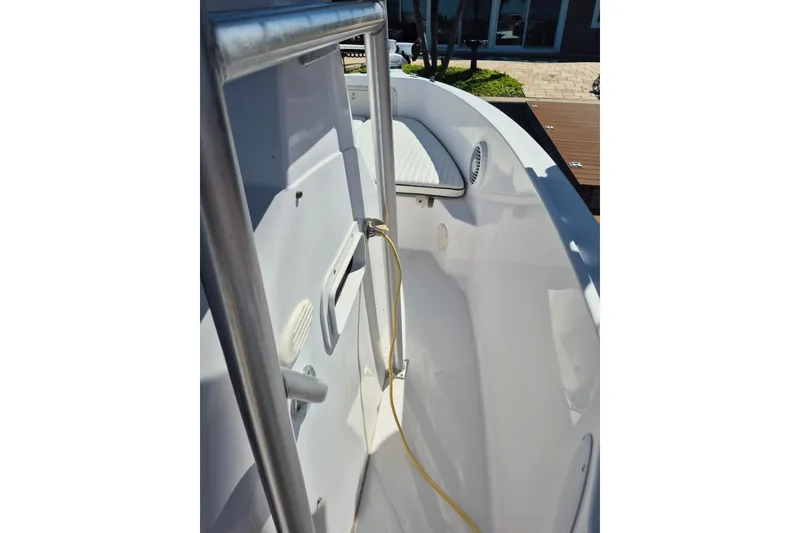 Slide: The Image of 2000 Pro-Line 24 Sport boat interior with stainless steel railing and seating area. - 42