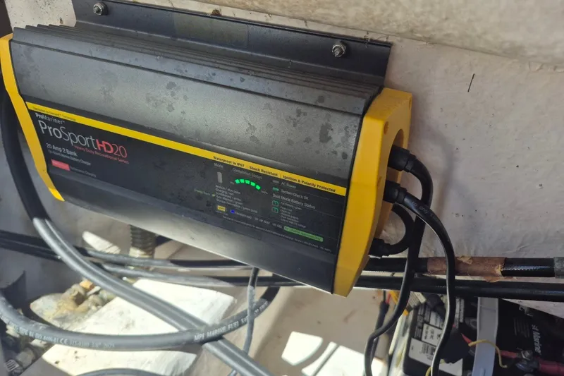 Slide: The Image of ProMariner ProSport HD20 battery charger installed on a 2000 Pro-Line 24 Sport boat. - 24