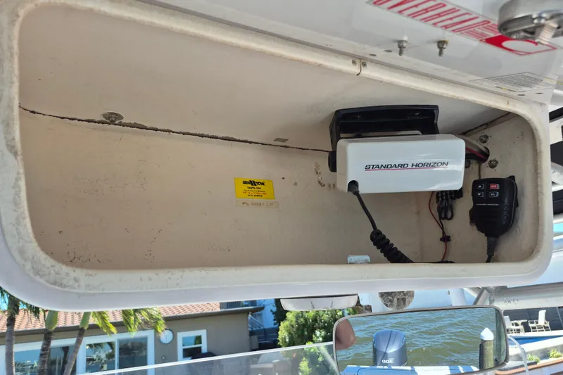 Slide: The Image of Interior of a 2000 Pro-Line 24 Sport boat with Standard Horizon radio equipment. - 44