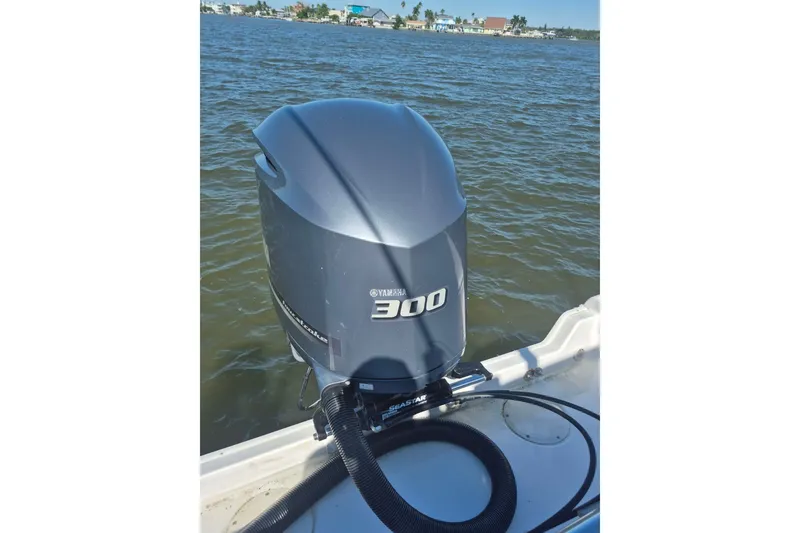 Slide: The Image of Outboard motor on 2000 Pro-Line 24 Sport boat, Yamaha 300, on water. - 17