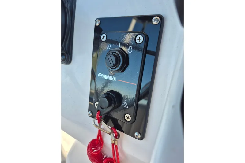 Slide: The Image of Yamaha control panel on 2000 Pro-Line 24 Sport boat with safety lanyard. - 13
