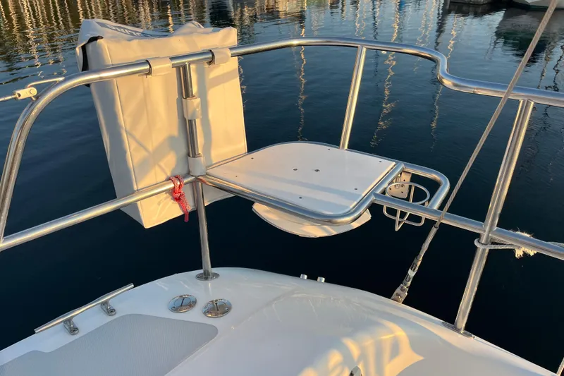 Slide: The Image of Stern view of a 2005 Catalina 320 sailboat with stainless steel railings. - 32