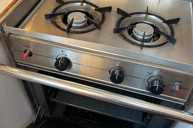 Slide: The Image of Stainless steel stove with dual burners in a 2005 Catalina 320 yacht kitchen. - 13
