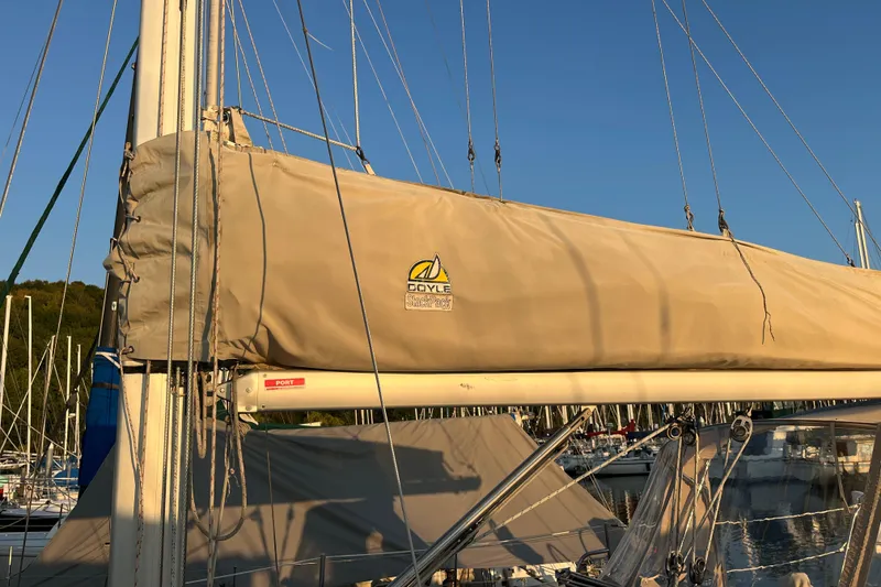 Slide: The Image of Sailboat mast and boom of 2005 Catalina 320 with Doyle sail cover in marina. - 21