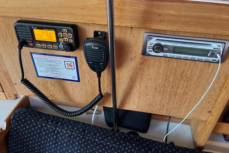 Slide: The Image of Control panel of a 2005 Catalina 320 sailboat with radio and stereo system. - 14