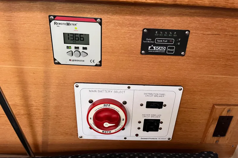 Slide: The Image of Control panel of a 2005 Catalina 320 sailboat with battery selector and tank monitor. - 16