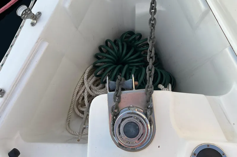 Slide: The Image of Anchor chain and ropes in a 2005 Catalina 320 sailboat compartment. - 18