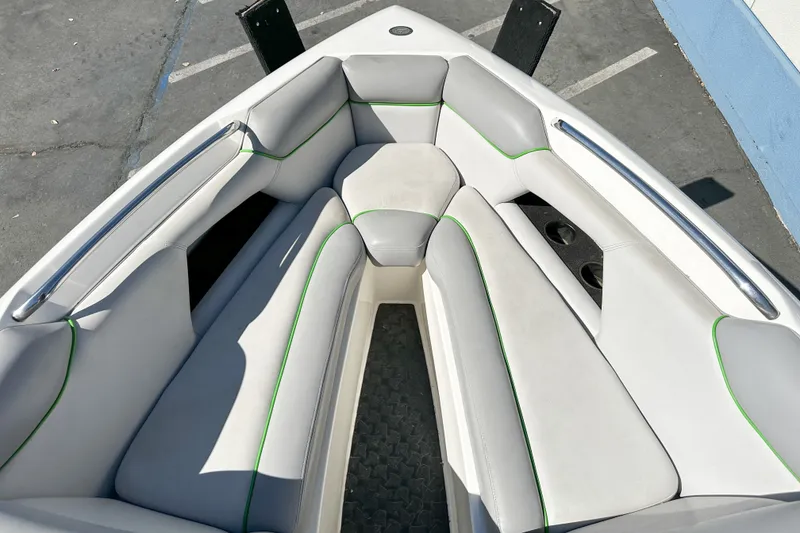 Slide: The Image of 2008 Centurion Air Warrior Elite Bowrider interior with white and green-accented seating. - 14