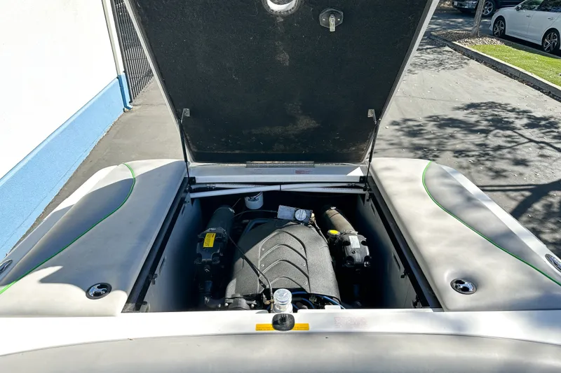 Slide: The Image of 2008 Centurion Air Warrior Elite Bowrider engine compartment with open hatch, showing engine details. - 15