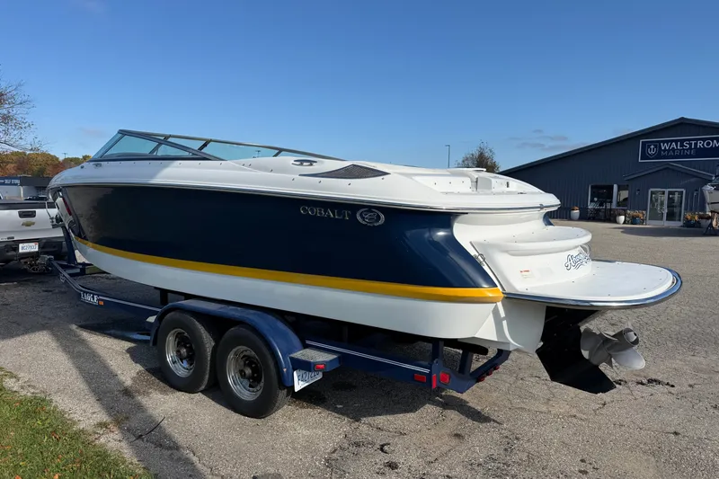 Slide: The Image of 2004 Cobalt 250 boat on trailer at Walstrom Marine dealership. - 10