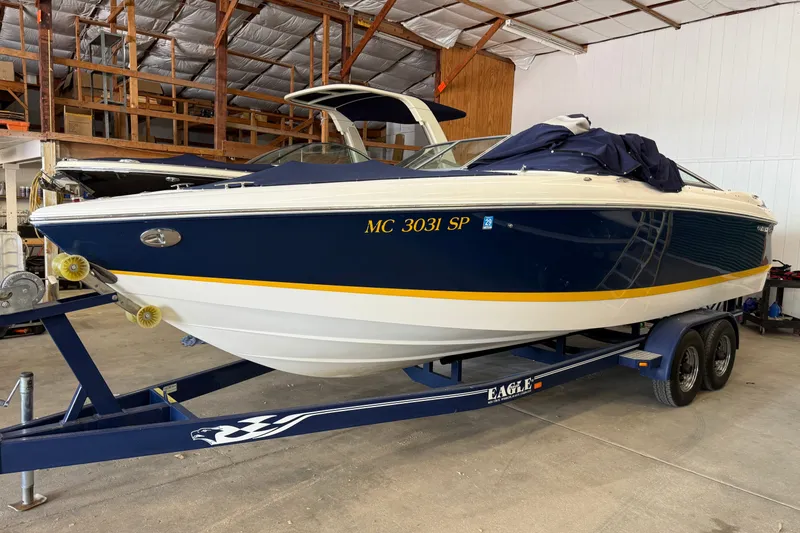 Slide: The Image of 2004 Cobalt 250 boat on trailer in indoor storage facility. - 5