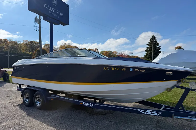 Slide: The Image of 2004 Cobalt 250 boat on trailer at Walstrom Marine dealership. - 8