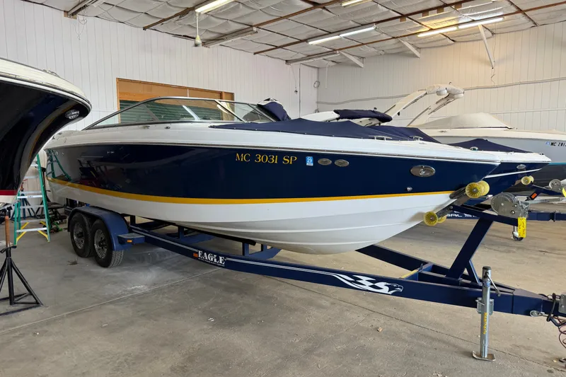 Slide: The Image of 2004 Cobalt 250 boat on trailer in indoor storage facility. - 6