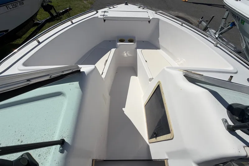 Slide: The Image of 1994 Grady-White Tournament 197 boat interior with seating and cup holders. - 14