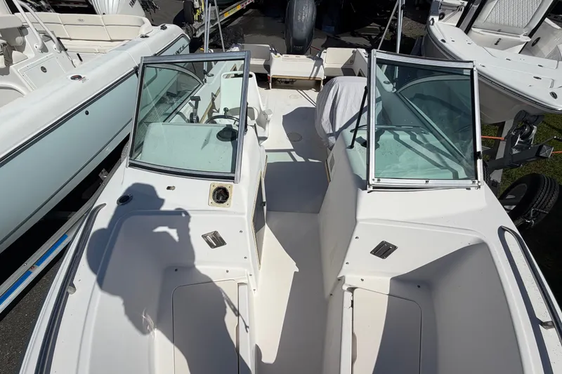 Slide: The Image of 1994 Grady-White Tournament 197 boat interior with dual consoles and windshield. - 15