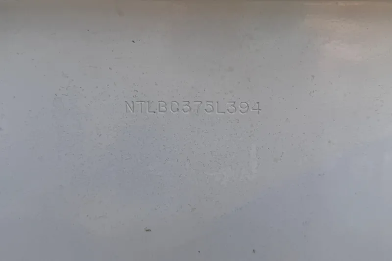 Slide: The Image of 1994 Grady-White Tournament 197 hull identification number (HIN) on white surface. - 19