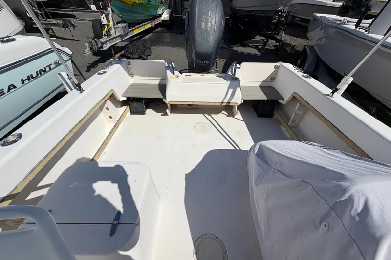 Slide: The Image of 1994 Grady-White Tournament 197 boat interior with engine and seating area. - 17
