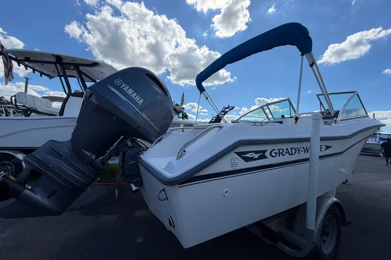 The Image of 1994 Grady-White Tournament 197 boat with Yamaha outboard motor, parked under a blue sky. - 0