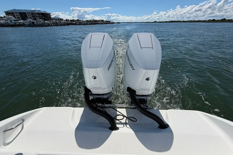 Slide: The Image of 2010 Yellowfin 32 Offshore boat with dual Mercury outboard engines on water. - 27