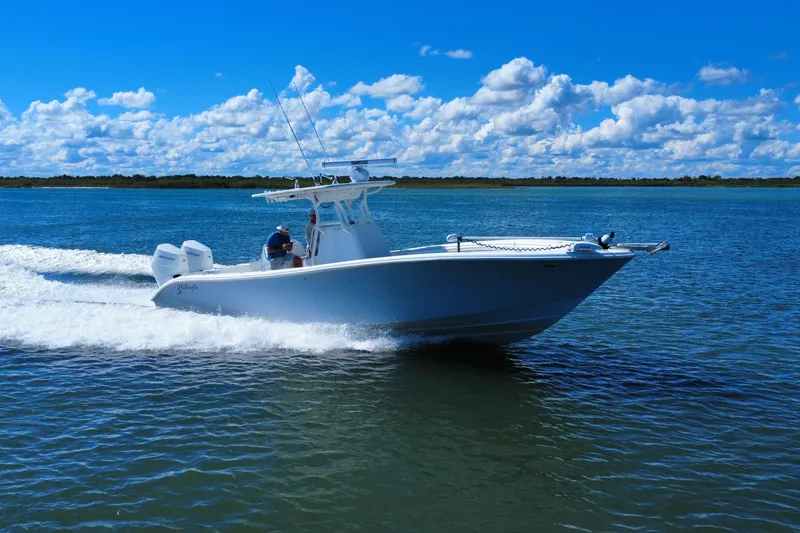 Slide: The Image of 2010 Yellowfin 32 Offshore boat cruising on a sunny day with blue skies. - 4